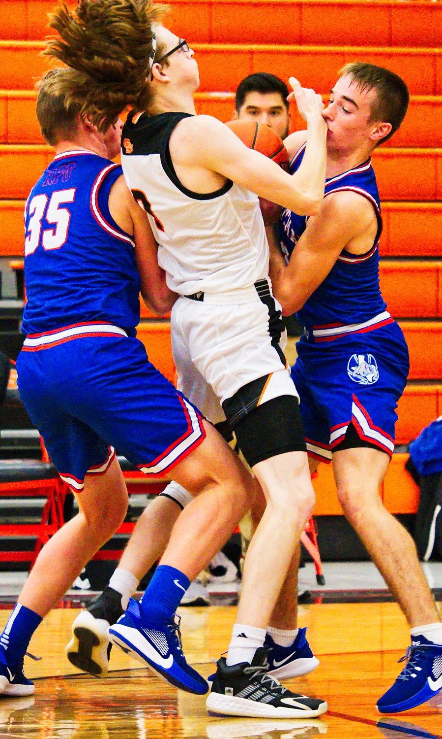 Garin Kisinger, left, and Ford Tannebaum converge defensively on the Grand Saline player.